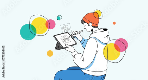 Creative Designer Working On Tablet Creating Modern Graphic Designs and Sketches.