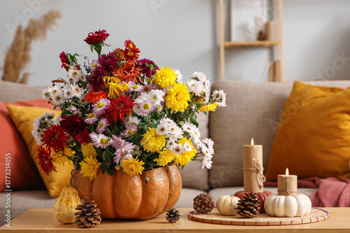 Wallpaper Mural Pumpkin with autumn flowers and burning candles on table in interior of living room, closeup Torontodigital.ca