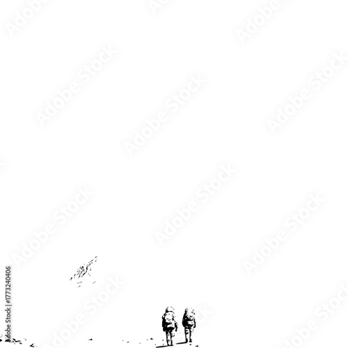 Two astronauts walking on a desolate landscape with a mountain in the distance in a black and white image