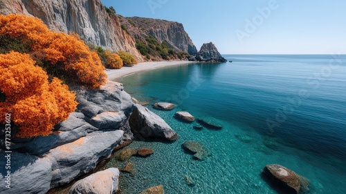 Vibrant Coastal Cliff With Wild Autumn Vegetation And Crystal Clear Turquoise Sea Under A Bright Blue Sky