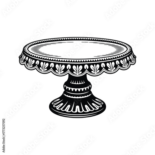 Ornate vintage cake stand with decorative pedestal and rim