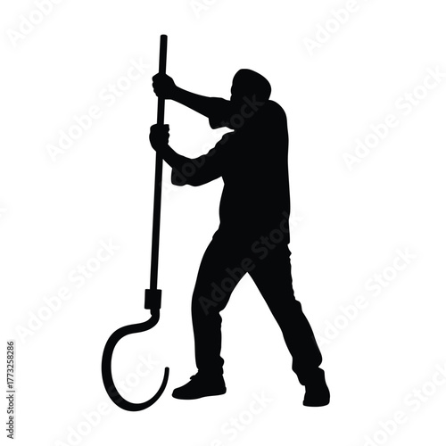 Silhouette of a person holding a large fishing hook and pole
