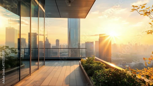 Sunset view from a modern balcony overlooking a city skyline with vibrant lighting and natural greenery
