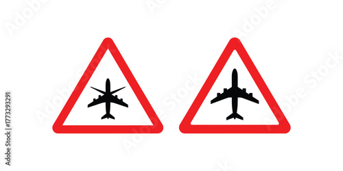 Two red triangular warning signs depicting silhouettes of airplanes indicating potential aviation hazards or airport proximity