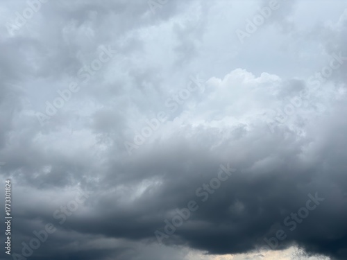 A dense blanket of dark, heavy grey clouds, suggesting an approaching storm, rain, or a heavily overcast sky.