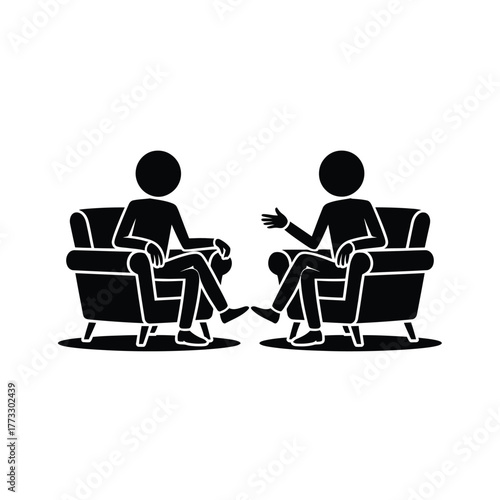 Two people sitting in chairs talking and gesturing