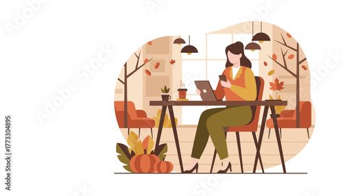 Woman working remotely with devices in a cozy autumn cafe setting