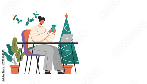Working remotely during Christmas Woman uses smartphone at a festive desk with laptop
