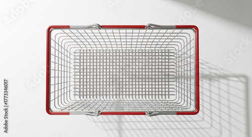 Top view of an empty red metal shopping basket isolated on white background