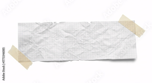 Crumpled paper with grid lines taped to a white background