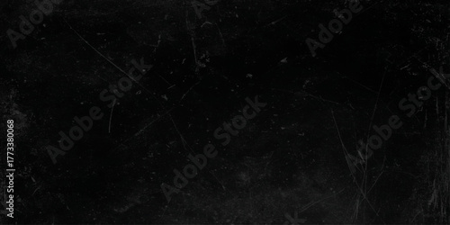 Old black toned grunge rough scratched textured wall, Empty surface of Black stone or grunge charcoal black board or chalk board texture, grainy Marble Black Texture Background.