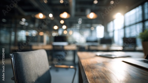 Wallpaper Mural A modern office space with a focus on a chair and wooden desk, illuminated by warm lighting and large windows, creating a cozy, professional atmosphere. Torontodigital.ca
