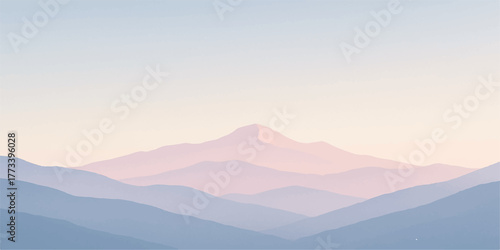 Misty mountain landscape at sunrise with clouds and light illuminating the valley