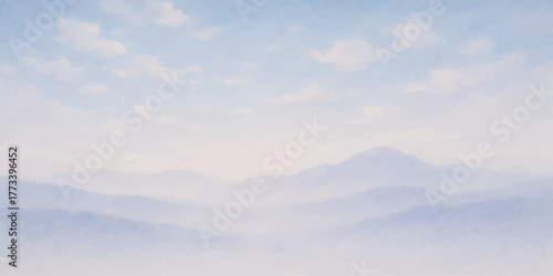 High aerial view of bright white clouds filling the blue sky over the mountain landscape