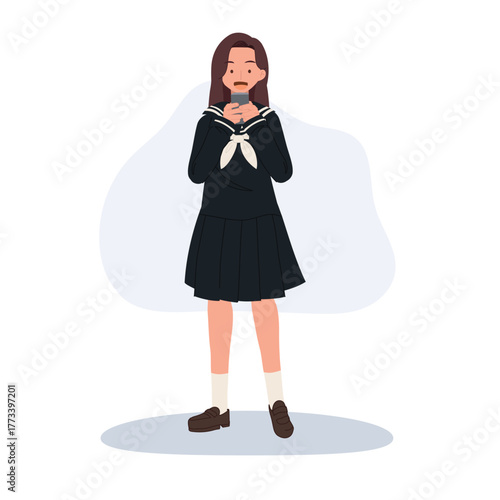 japanese student using mobile phone. teenage girl reading smartphone message in japanese school uniform