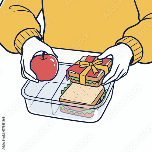 Person placing an apple and sandwich into a container for lunch  
