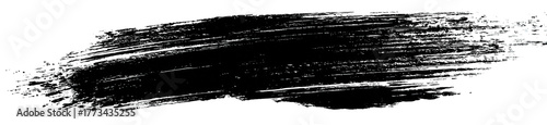 A dark, textured brush stroke with white speckles against a black background