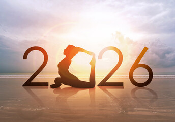 Fototapete Yogaschule Happy new year card 2026. Silhouette of healthy girl doing Yoga One Legged Pigeon pose on tropical beach with sunset sky background, woman practicing yoga as a part of the Number 2026 sign.  © maemanee