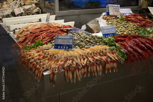 Various shrimps and seafood arranged for sale at a fish market in Spain,