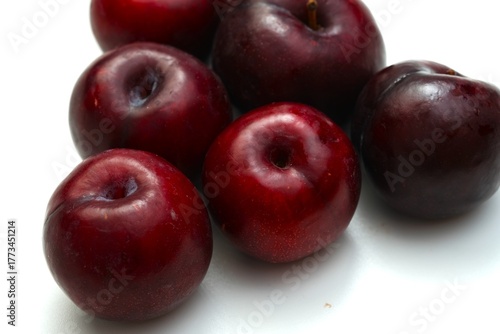 Fresh ripe red plums close-up for healthy eating
