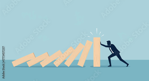 Silhouette of a man stopping a falling domino sequence against a blue background.