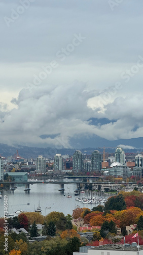 Modern downtown Vancouver skyline with False Creek waterfront in autumn colors, British Columbia, Canada.