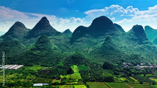 Panoramic landscape of the famous and beautiful karst mountain range with green fields