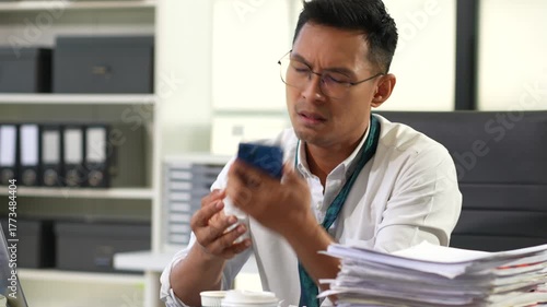 Male businessman talking on the phone arguing work problems  customer dissatisfaction.