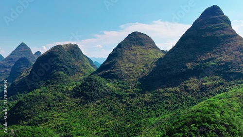 Aerial view of the iconic green karst mountain peaks on a clear day in southern China.