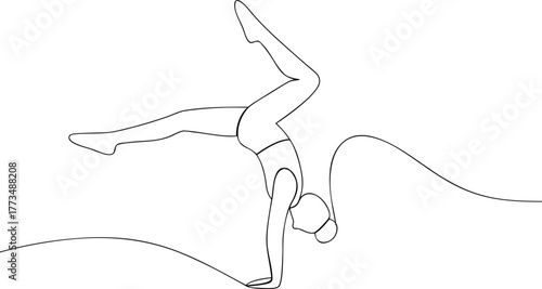 Woman performing a handstand in a gymnastic pose gymnastics