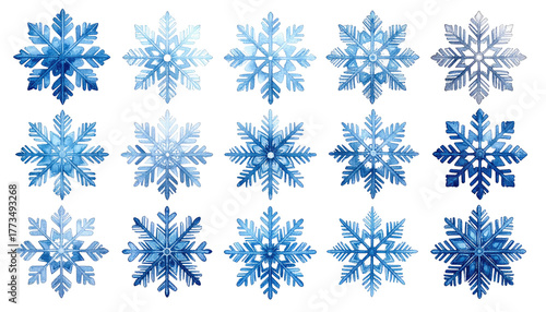 Assorted blue snowflakes isolated against a stark black backdrop