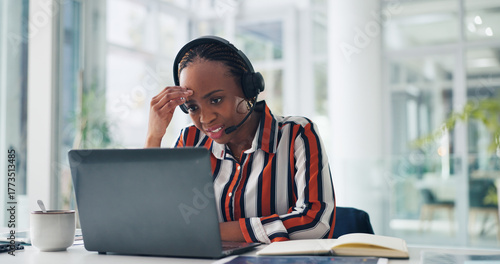 Woman, headset and stress with laptop at office, mistake or guide for customer service at company. African person, consultant and agent with voip tech, pc or crisis with contact, advice and help desk