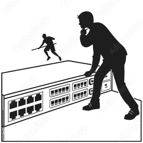 Silhouette of man looking at network switch