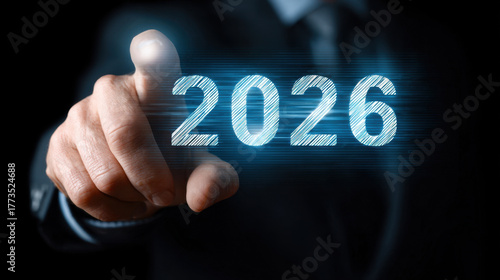 Wallpaper Mural Businessman touching virtual screen displaying year 2026, symbolizing future technology and innovation. image conveys sense of progress and forward thinking Torontodigital.ca