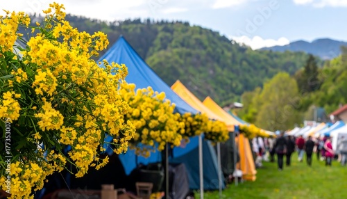 Vibrant yellow flowers adorn market stalls nestled in a mountain valley