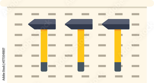 Hammers with yellow handles hanging on a perforated panel, ready to be used for various tasks