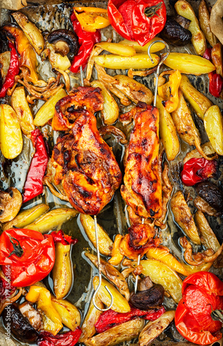 Grilled chicken skewers on a tray, barbecue.