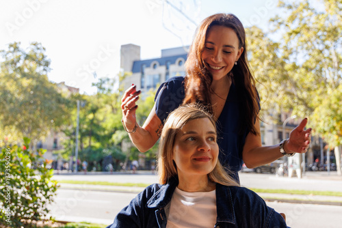 Women tourists sitting at an outdoor café table, discussing monuments and local attractions