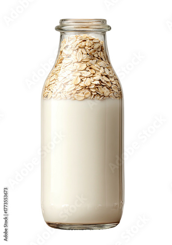 Glass bottle filled with creamy milk and rolled oats