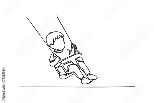 Child joyfully swinging on a rope swing