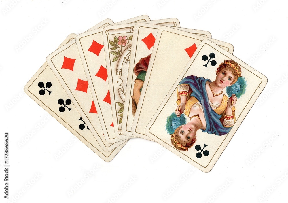 Fotografie A hand of vintage playing cards isolated on a white background.