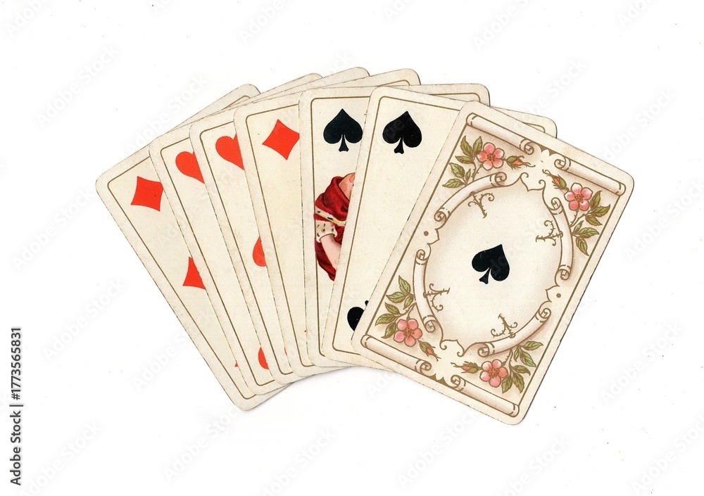 Obraz premium A hand of vintage playing cards isolated on a white background.