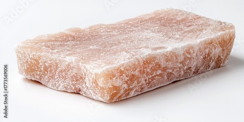 A thick, rectangular slab of cured salmon, coated in coarse sea salt. The salmon is a pale pink color with a slightly rough, textured surface.