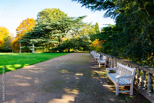 Obraz na płótnie Park Pathway with Benches, Stone Balustrade and Early Autumn Trees in Nottingham