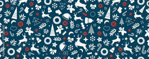 Christmas seamless pattern with holiday elements. Reindeer, stars, trees, and sweets in festive winter composition on blue background