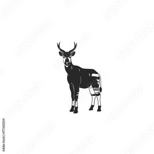 Silhouette of an Okapi standing gracefully.
