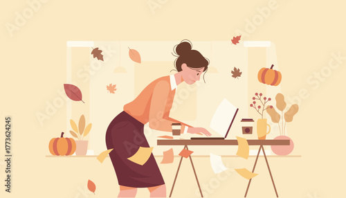 Busy businesswoman works intensely at a laptop surrounded by autumn decor and scattered papers