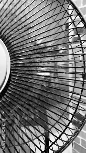 Slow-Mo Dusty Fan in Monochrome Motion
A dusty fan spins in slow motion, captured in black and white. The close-up highlights texture, rhythm, and industrial atmosphere.