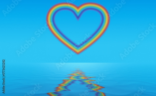 Heart shape rainbow in the sky reflecting in water surface.