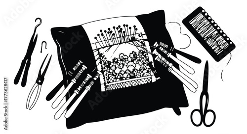 Creative crafting tools arranged around a fabric cushion with a needlepoint design